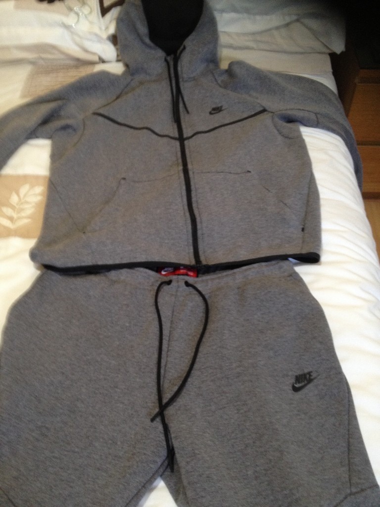 nike tracksuit zip pockets